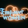 A neon sign with the words 'Empower Women' in bright blue letters against a dark background. The lettering is surrounded by an artistic design of neon orange loops, adding a decorative touch to the sign.