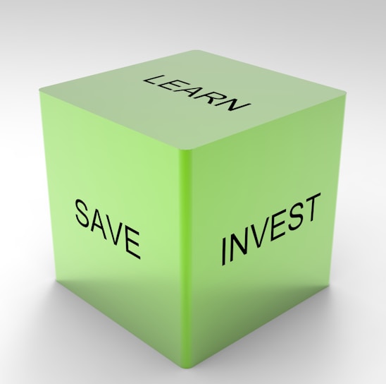 A green 3D cube with the words 'LEARN', 'SAVE', and 'INVEST' on its visible sides, set against a plain white background.